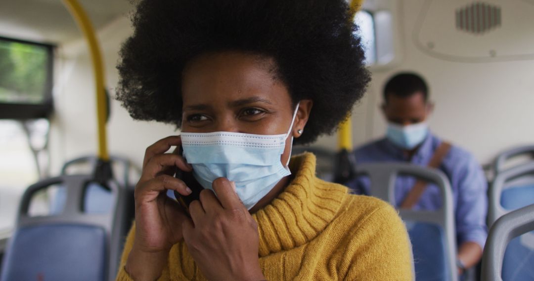 Woman in Face Mask Talking on Mobile Phone in Public Transport