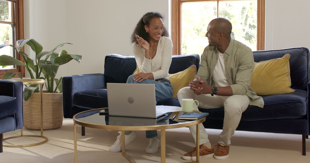 Couple Enjoying Conversation with Laptop at Home