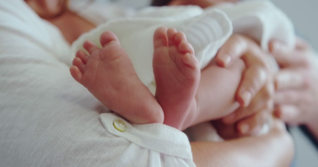 Close-up of Newborn Baby Feet Held by Parent in Cozy Home - Free Images, Stock Photos and Pictures on Pikwizard.com