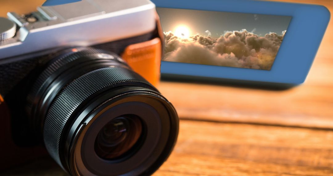 Close-Up of Digital Camera with Cloud Image Display