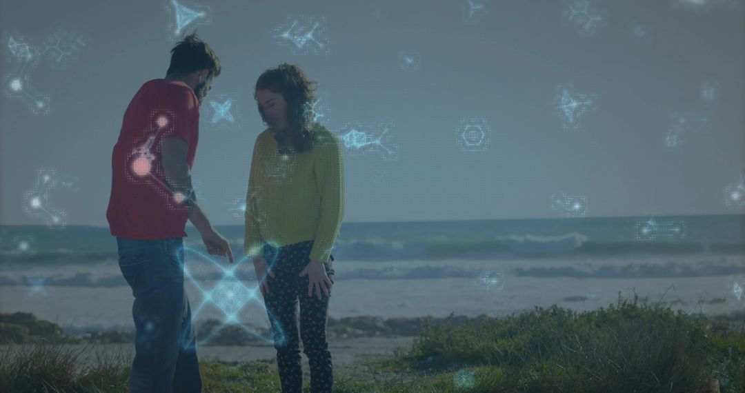 Couple Pointing on Beach Dune with Futuristic Blue Holographic Data Overlays