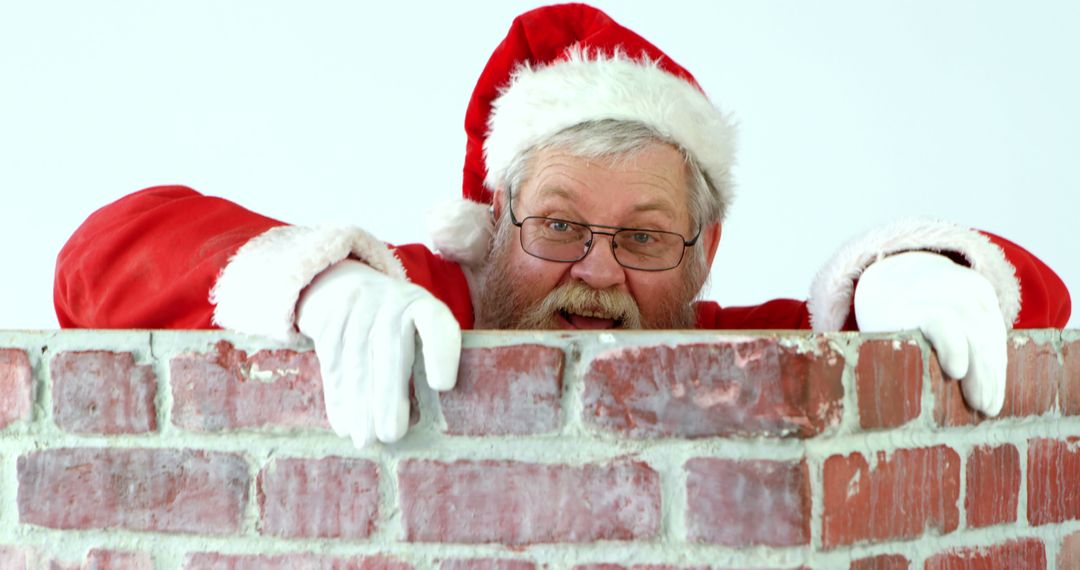 Happy Santa Claus Peeking Over Chimney in Festive Christmas Attire - Free Images, Stock Photos and Pictures on Pikwizard.com