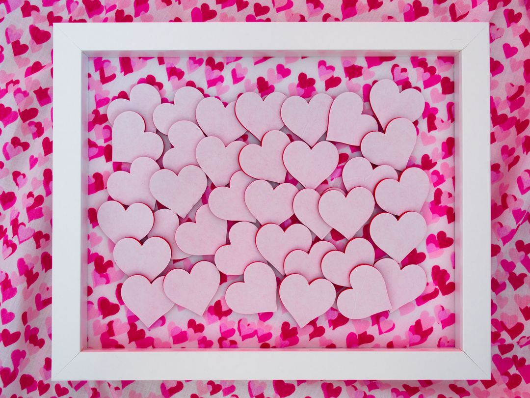 Heart-shaped Cutouts in White Frame on Vibrant Background