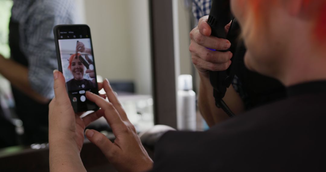 Customer Taking Selfie While Getting Haircut in Modern Salon - Free Images, Stock Photos and Pictures on Pikwizard.com