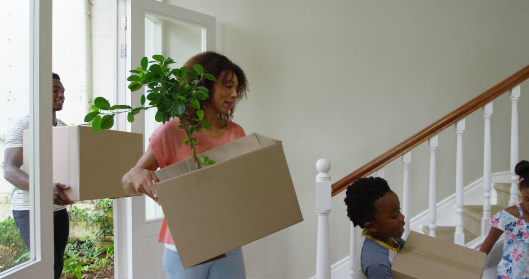 Family Moving Into New Home With Boxes - Free Images, Stock Photos and Pictures on Pikwizard.com