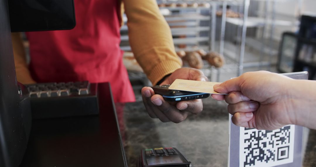 Customer Using Smartphone for Contactless Payment at Bakery - Free Images, Stock Photos and Pictures on Pikwizard.com