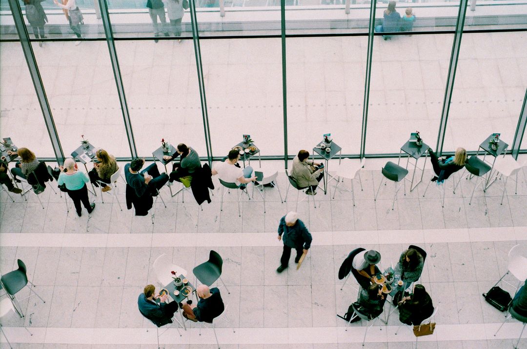 High Angle View of People Socializing in Modern Atrium