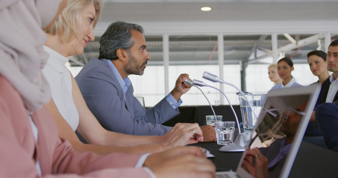 Business Delegates Engaging at Conference Panel Discussion