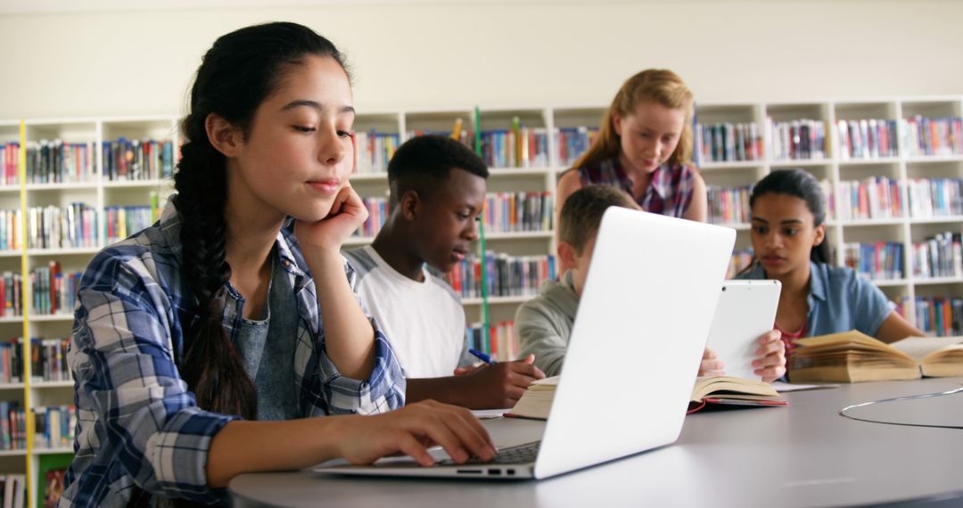 Diverse Group of Students Studying in School Library