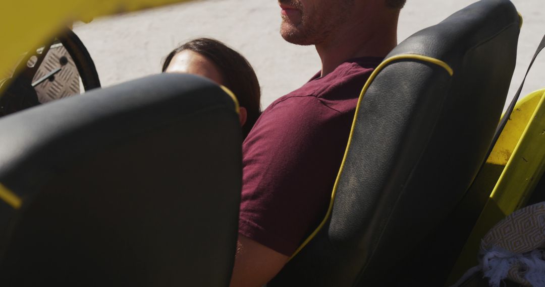 Couple Relaxing in Beach Buggy Near Ocean on Summer Day