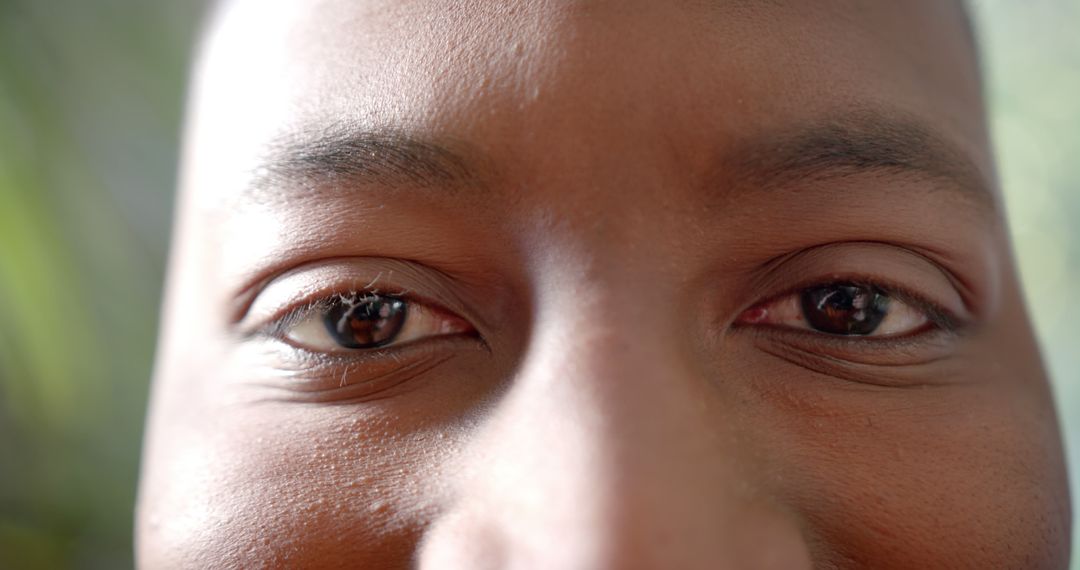 Close Up of Smiling African American Man's Eyes in Bright Sunlight - Free Images, Stock Photos and Pictures on Pikwizard.com