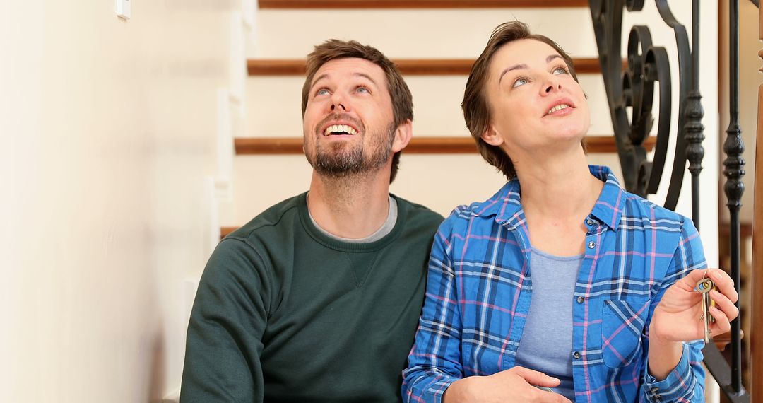 Happy Couple Spending Quality Time on Staircase at Home