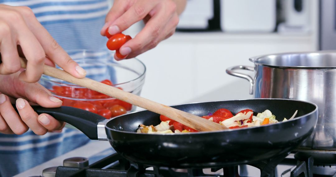 Couple Cooking Fresh Vegetables in Pan Together at Home - Free Images, Stock Photos and Pictures on Pikwizard.com