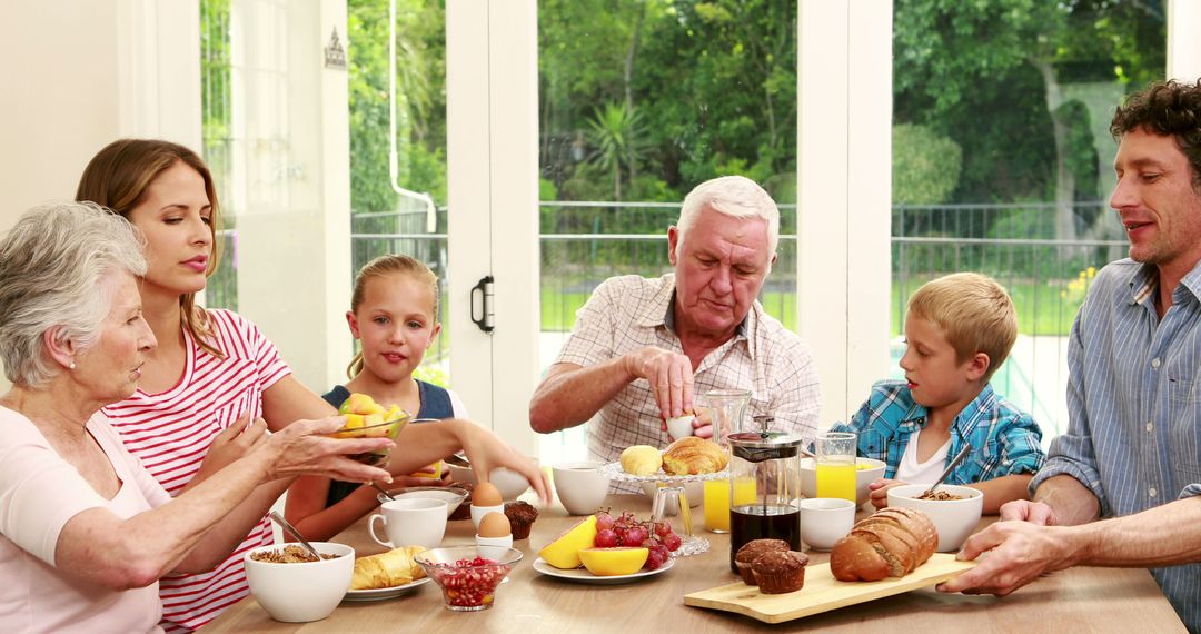 Happy Multigenerational Family Having Breakfast Together at Home - Free Images, Stock Photos and Pictures on Pikwizard.com