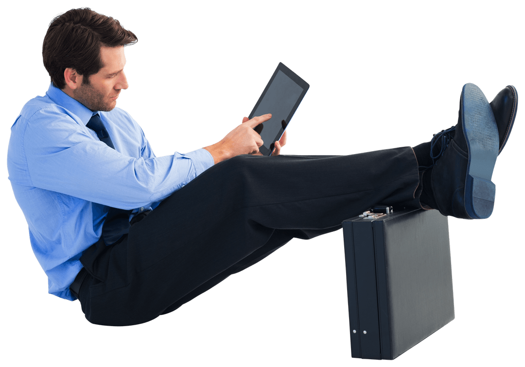 Businessman in Blue Shirt Using Tablet with Feet on Suitcase Transparent Background
