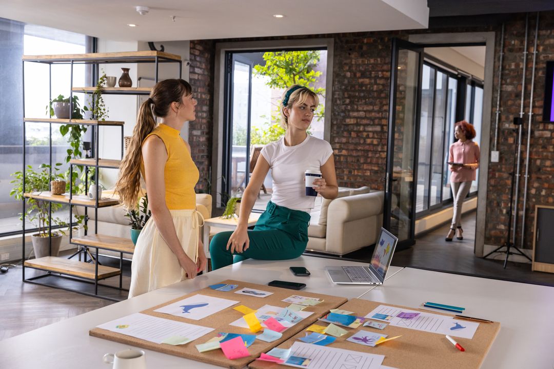 Creative Team Discussion on Design Layouts in Stylish Office