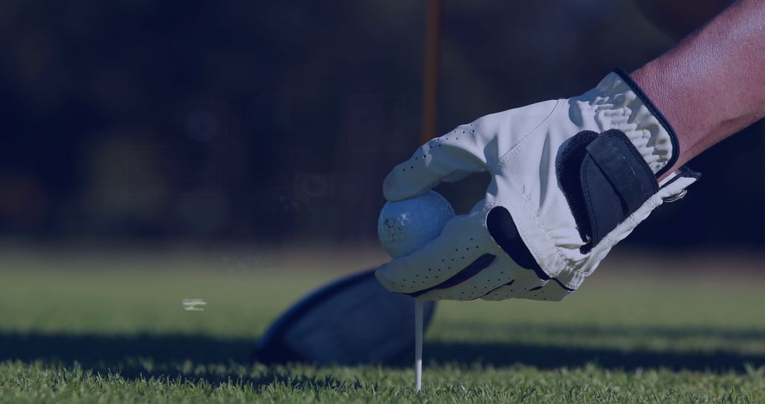 Close-Up of Golf Player Setting Ball on Tee with Focus on Gloved Hand