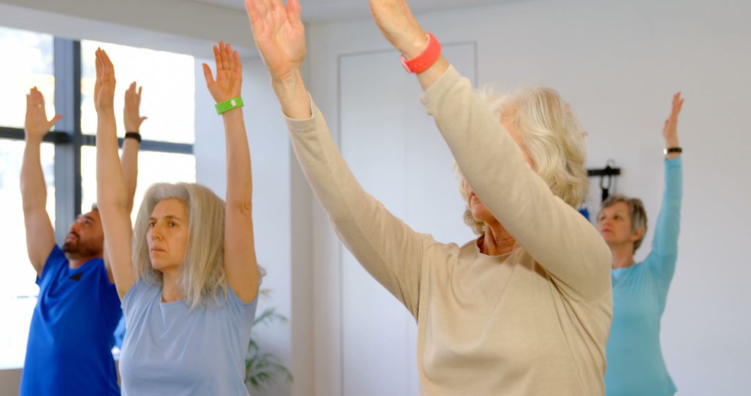 Senior Adults Practicing Yoga in a Group Class - Free Images, Stock Photos and Pictures on Pikwizard.com