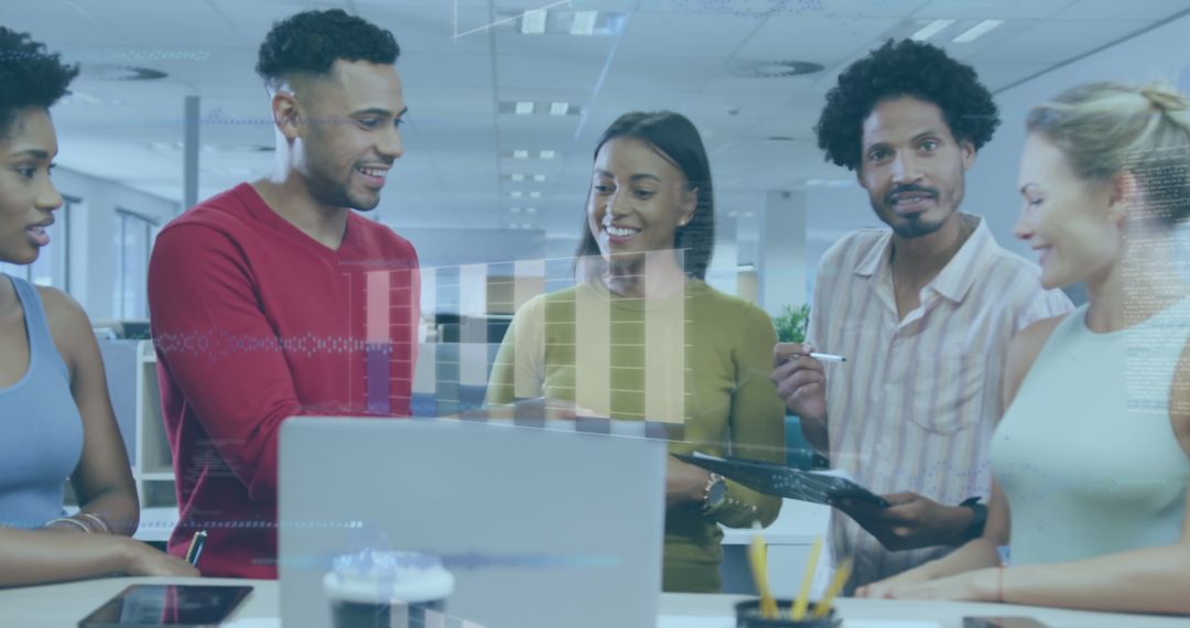 Diverse Coworkers Collaborating on Tech Project in Modern Office