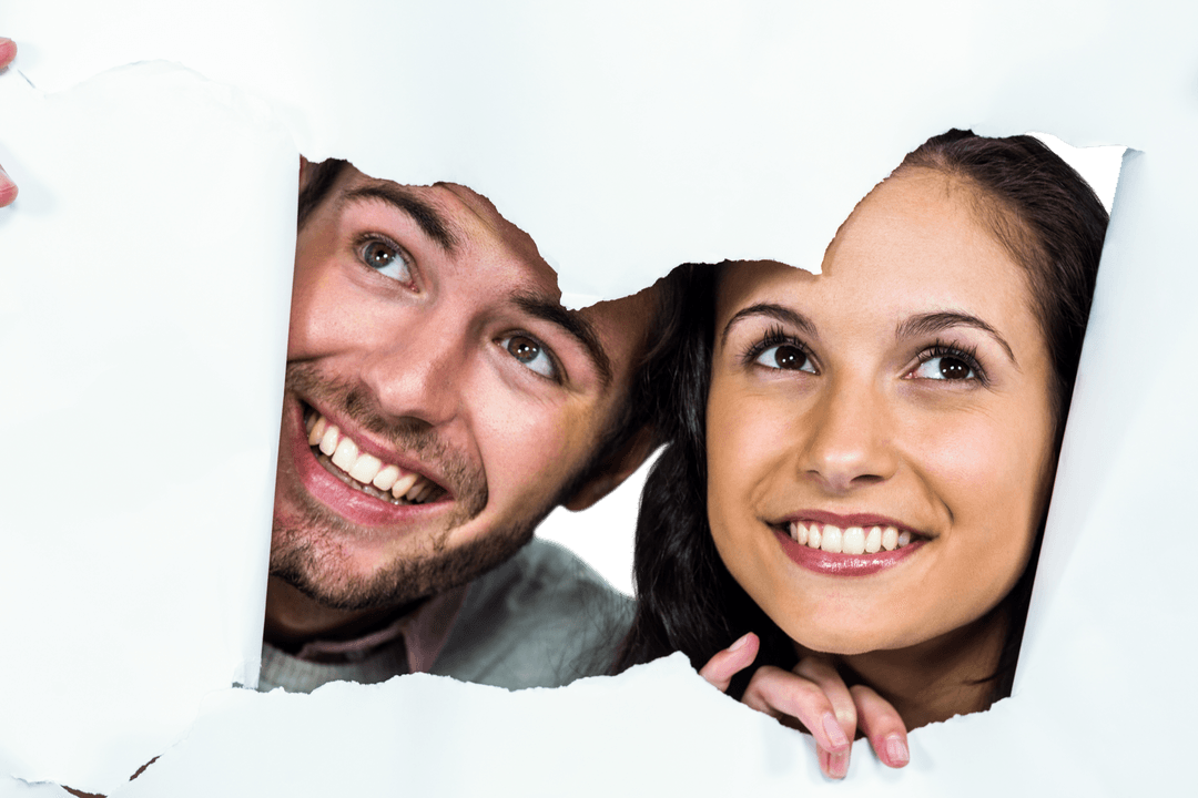 Cheerful Couple Peeking Through Transparent Torn Paper