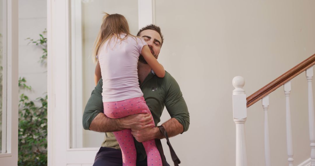 Father Embracing Daughter with Joy at Home - Free Images, Stock Photos and Pictures on Pikwizard.com