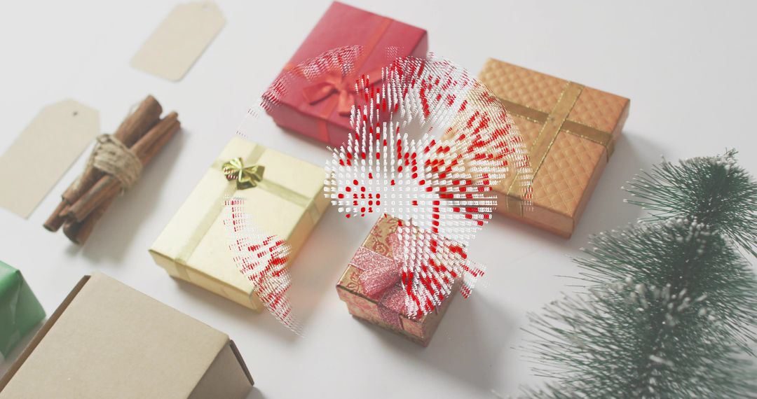 Displaying festive wrapped gift boxes with cinnamon sticks, tags, bows and evergreen accents