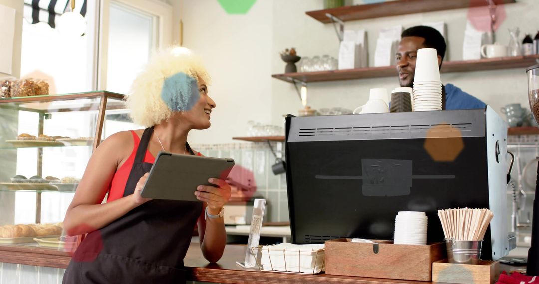 Barista Using Tablet at Modern Cafe Counter