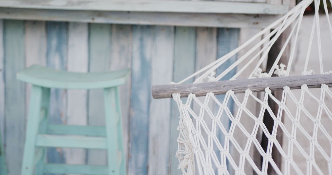 Relaxing Hammock by Colorful Wooden Cabin - Free Images, Stock Photos and Pictures on Pikwizard.com