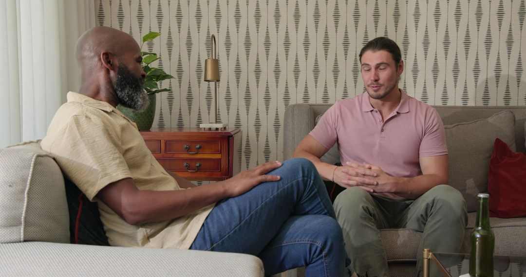 Thoughtful Conversation Between Friends in Cozy Living Room