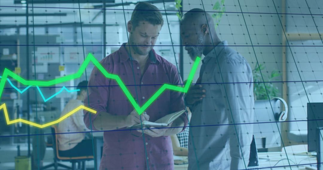 Business Colleagues Analyzing Data in Modern Office Setting