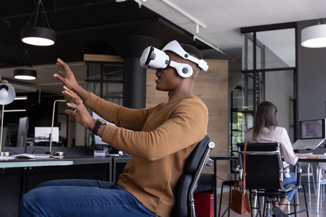 Professional Wearing VR Headset Gesturing in Modern Open-Plan Office Collaboration