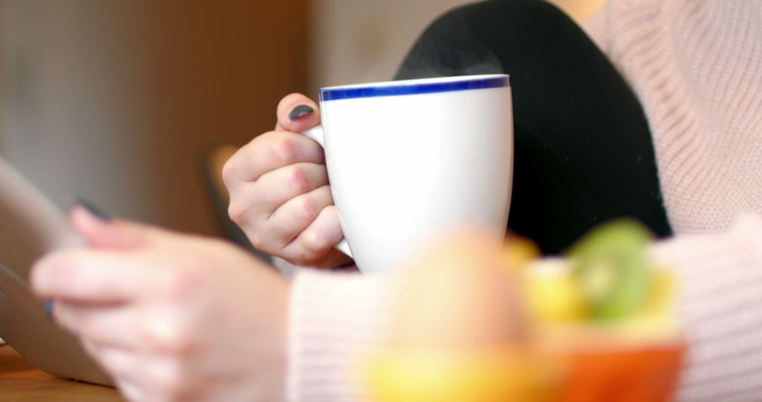 Close-Up of Hands Holding Coffee Mug and Tablet - Free Images, Stock Photos and Pictures on Pikwizard.com