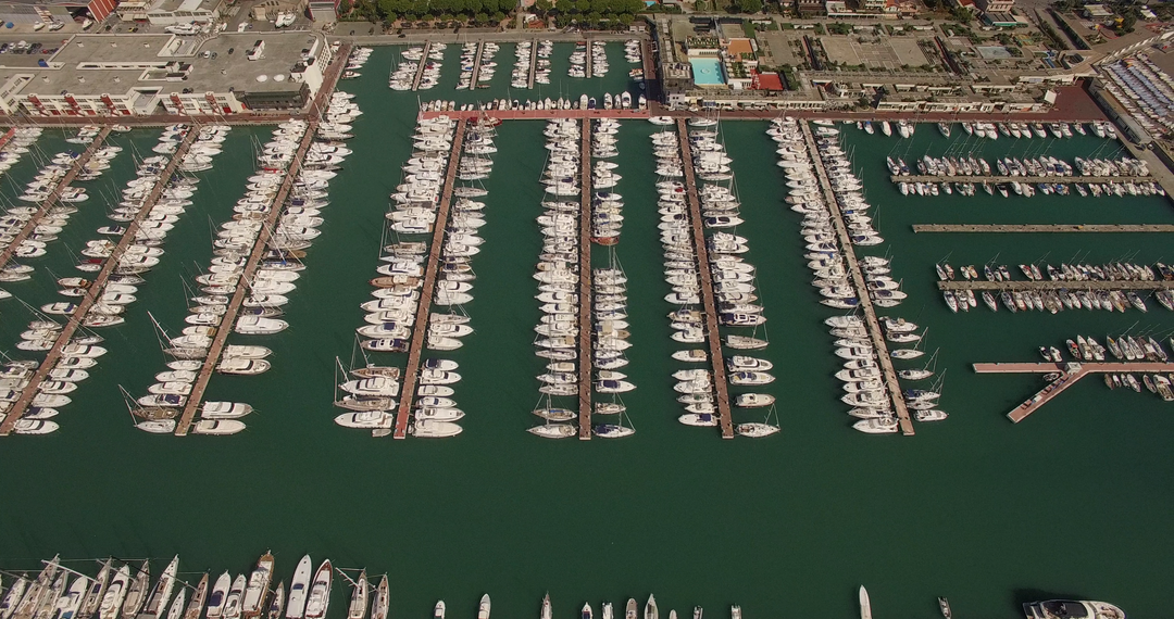 Aerial View Complète with Transparent Sail Boats Docking at Bustling Harbor - Download Free Stock Images Pikwizard.com