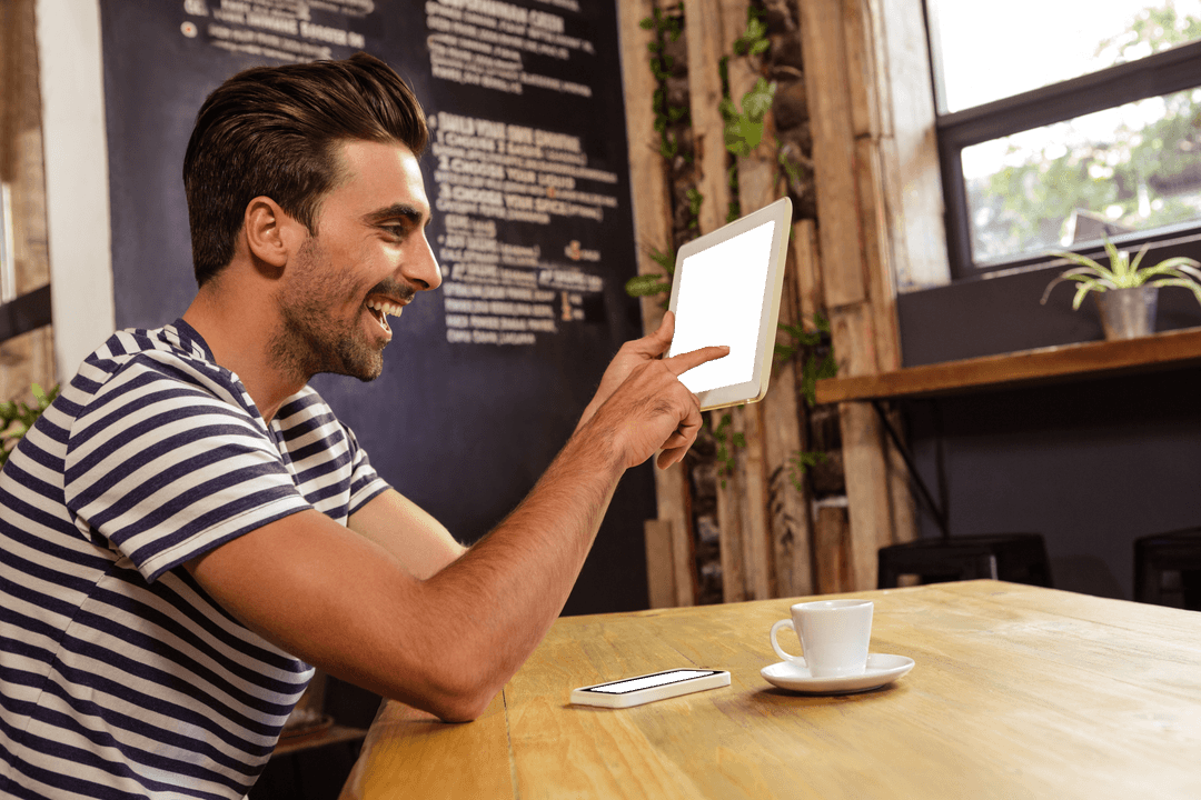 transparent tablet usage in cafe with smiling man - Download Free Stock Images Pikwizard.com
