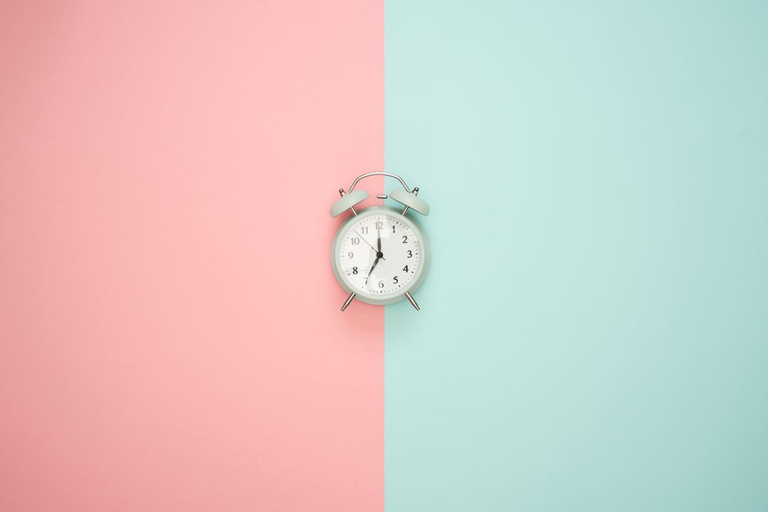 Retro Alarm Clock on Pastel Color Background