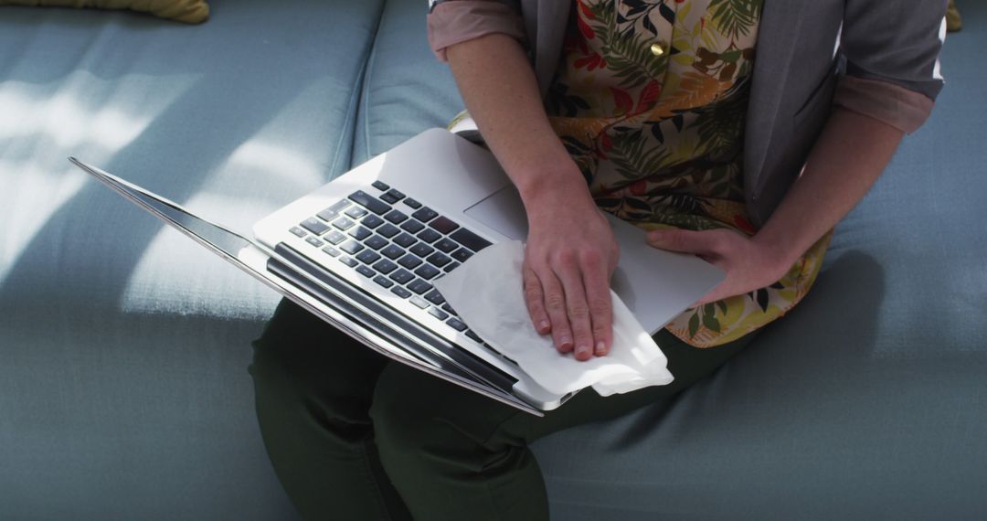 Person Cleaning Laptop with Disinfecting Wipe at Home - Free Images, Stock Photos and Pictures on Pikwizard.com