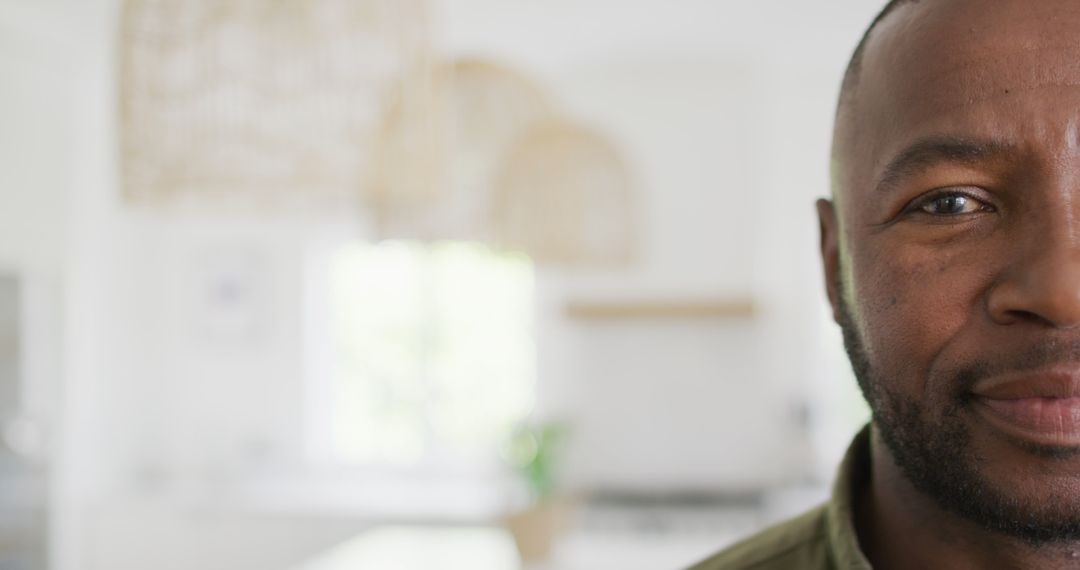 Half Face Portrait of Smiling African American Man at Home