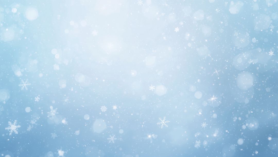Soft Falling Snowflakes with Bokeh Glow on Pale Blue Gradient Winter Backdrop