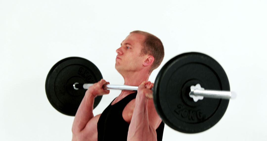 Man Lifting Barbell for Strength Training - Free Images, Stock Photos and Pictures on Pikwizard.com