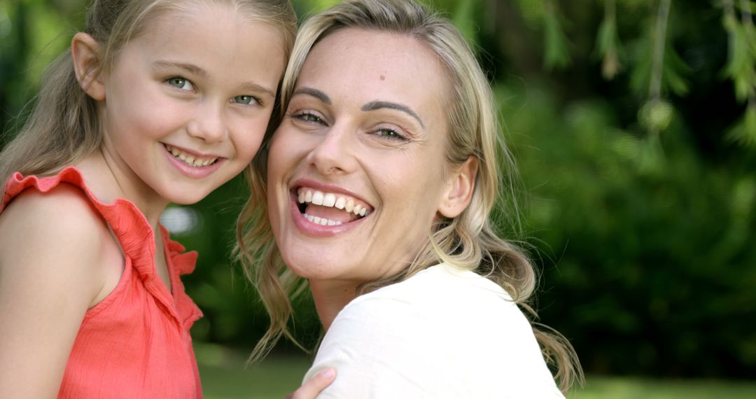 Mother and Daughter Smiling in Outdoor Setting - Free Images, Stock Photos and Pictures on Pikwizard.com