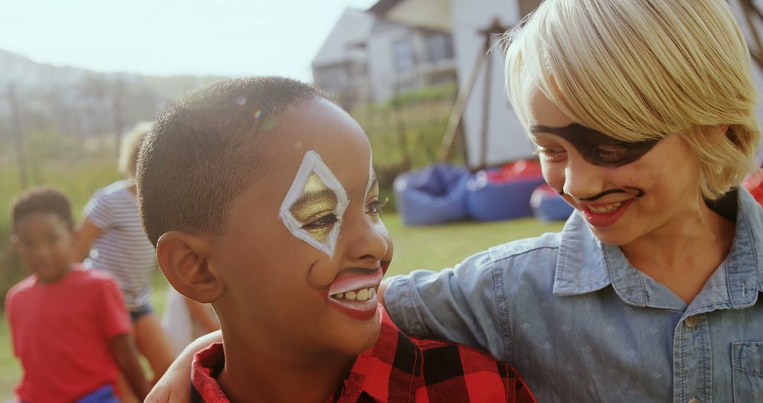 Children with Face Paint Smiling Outdoors - Free Images, Stock Photos and Pictures on Pikwizard.com