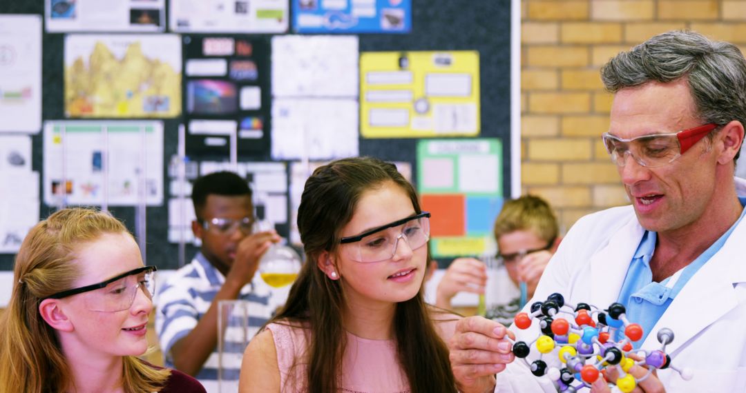 Teacher Guiding Students with Chemistry Model in Classroom - Free Images, Stock Photos and Pictures on Pikwizard.com