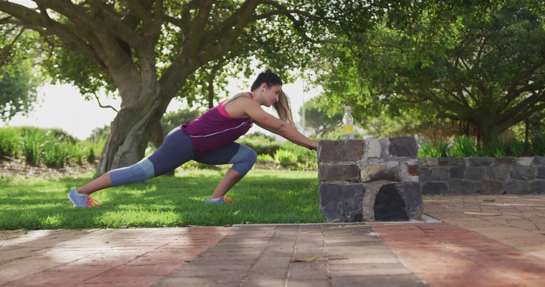 Woman Stretching in Outdoor Park for Fitness Routine - Free Images, Stock Photos and Pictures on Pikwizard.com