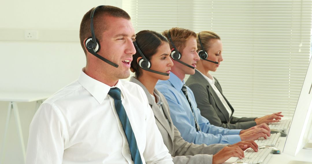 Multicultural Customer Support Team Wearing Headsets