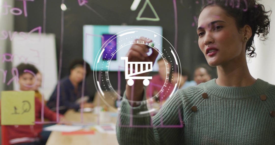 Professional writing on glass board during e-commerce strategy and team brainstorming