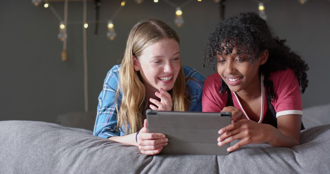Smiling Teenage Friends Enjoying Time with Tablet