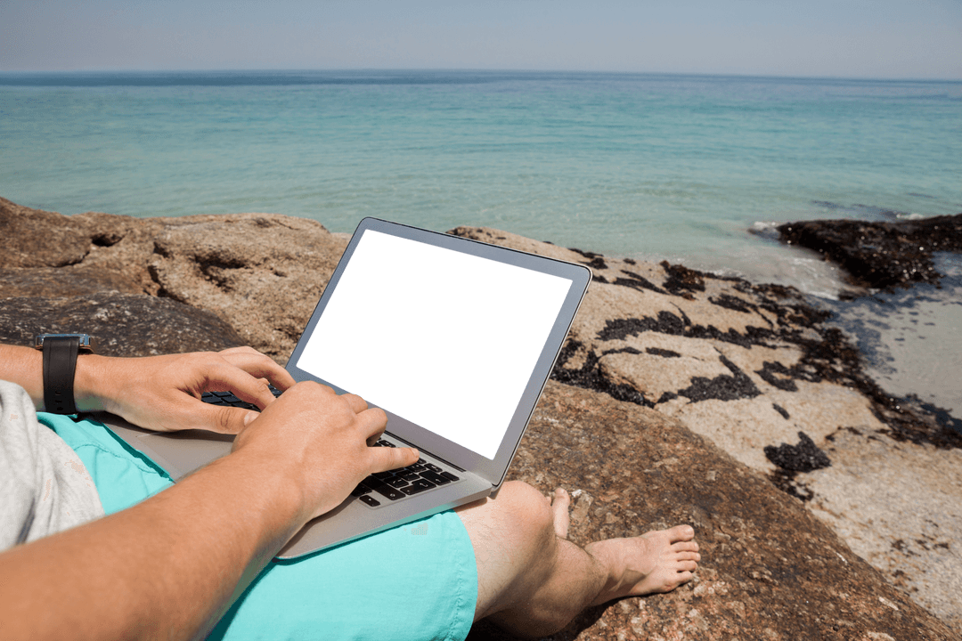 Man Enjoying Seaside with Transparent Laptop Screen