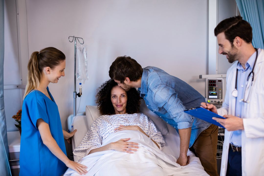 Man kissing pregnant woman on her forehead in the ward - Free Images, Stock Photos and Pictures on Pikwizard.com