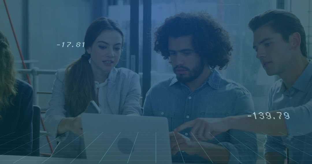 Colleagues Analyzing Data Together in Modern Office Setting