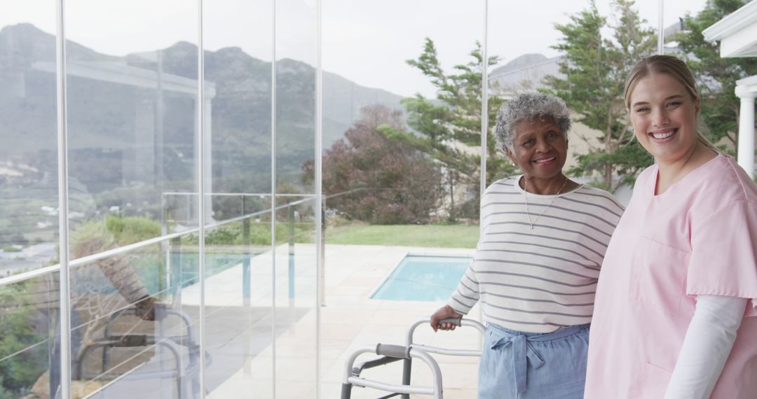 Senior Woman with Caregiver Enjoying Scenic View on Sunny Day - Free Images, Stock Photos and Pictures on Pikwizard.com